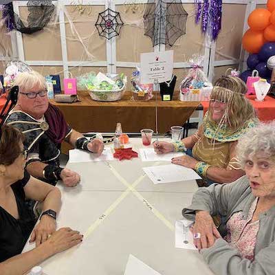 People at party table smiling