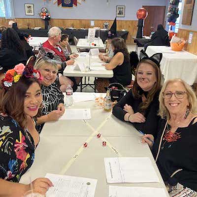 People at party table smiling