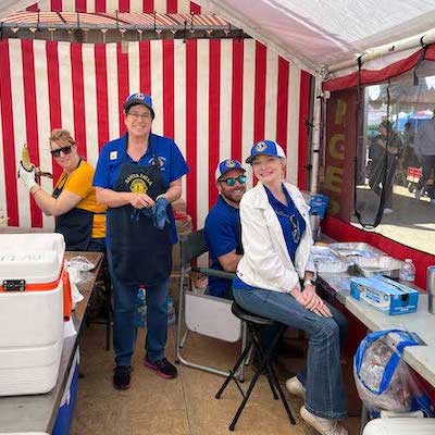 Underwood Farms booth with 3 people